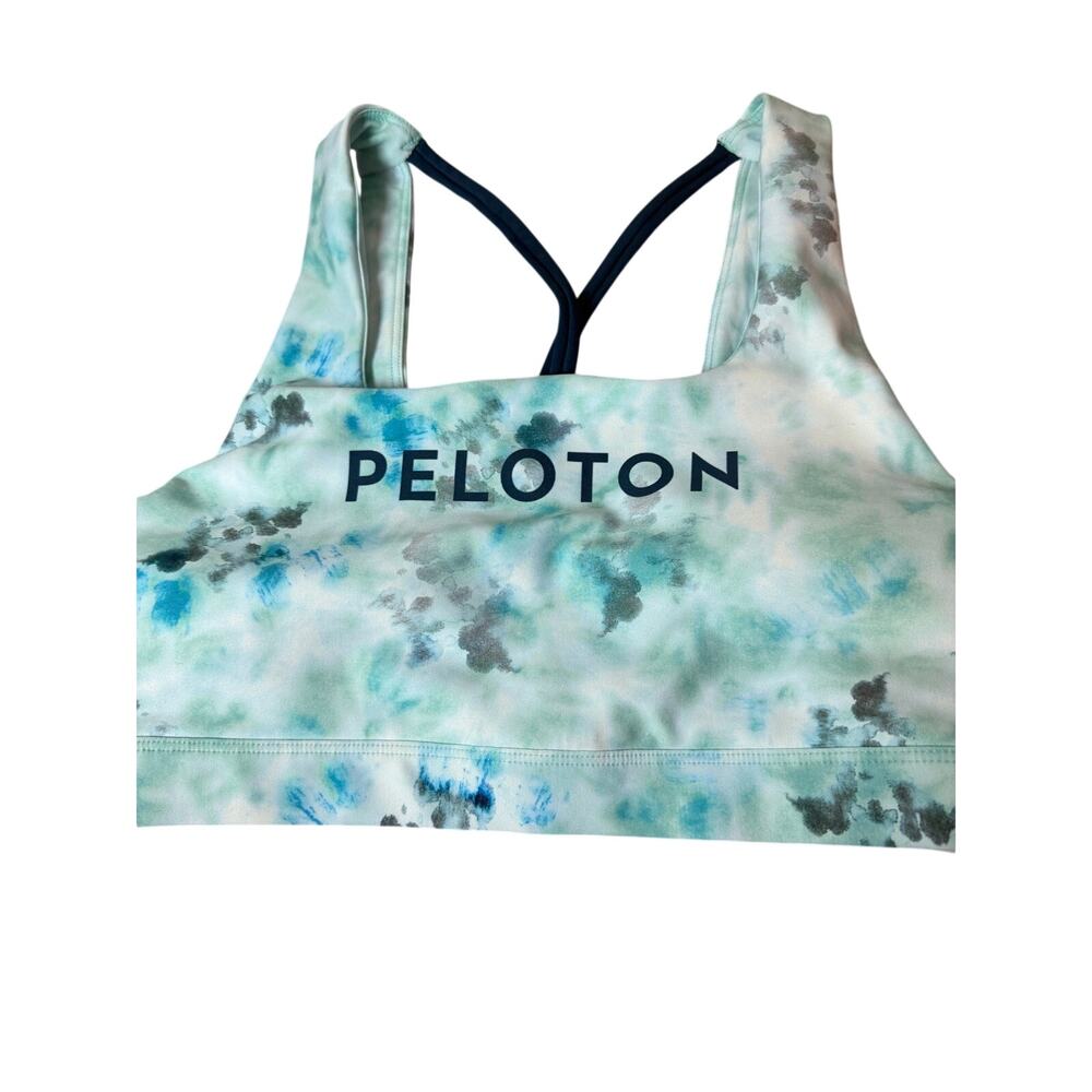 This is a Peloton Women's Blue Diamond Tie-Dye V Back Sports Bra.